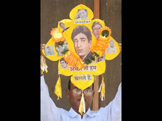 Indian kitemaker Jagmohan Kanojia displays a kite adorned with images of Bollywood actor Rajesh Khanna in Amritsar on July 19, 2012.
