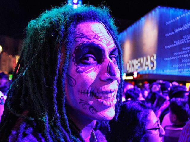 Kenny O'Brien, dressed as the Joker, poses while waiting for the midnight premiere of "The Dark Knight Rises", the final instalment of Christopher Nolan's Batman trilogy, in Universal City, California. (Reuters/Jonathan Alcorn)