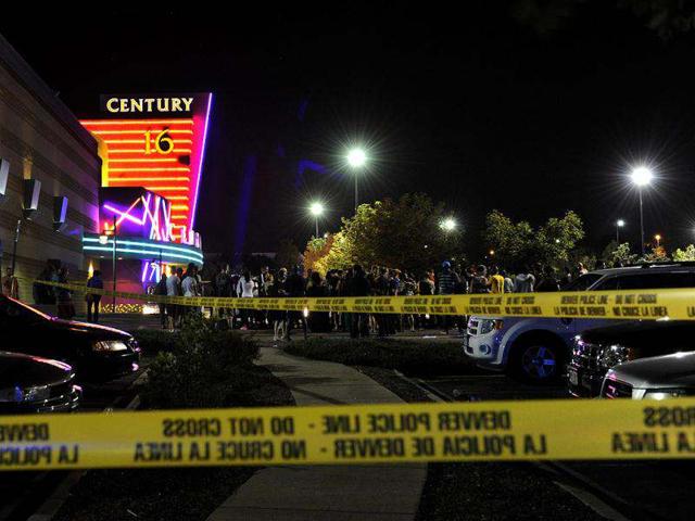 People gather outside the Century 16 movie theatre in Aurora, Denver, at the scene of a mass shooting. AP Photo