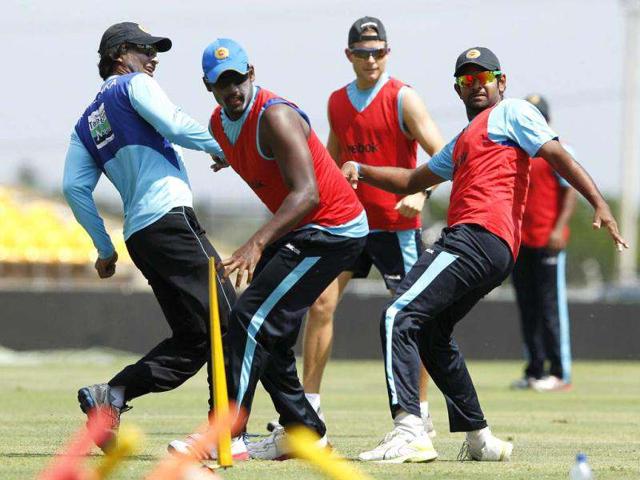 Sri Lanka's Kumar Sangakkara (L), Thisara Perera (2nd L) and Lahiru Thirimanne (R) react as they play football during a practice session ahead of their first One Day International (ODI) cricket match against India in Hambantota. Reuters/Dinuka Liyanawatte