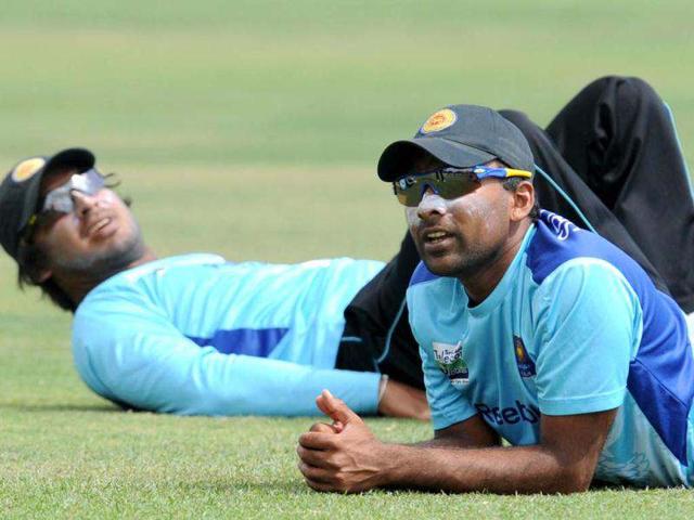Sri Lanka cricket captain Mahela Jayawardene (R) and Kumar Sangakkara (L) look on during a practise session at the Suriyawewa Mahinda Rajapakse International Cricket Stadium in the southern district of Hambantota. AFP Photo/Ishara S. Kodikara