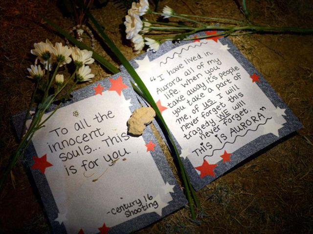 A makeshift memorial is shown at the Century 16 movie theatre where a gunmen attacked movie goers during an early morning screening of the new Batman movie "The Dark Knight Rises" in Aurora, outside of Denver, Colorado. (Kevork Djansezian/Getty Images/AFP)