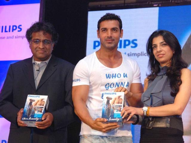 John Abraham flaunts his muscular body in a fitted white-tee.