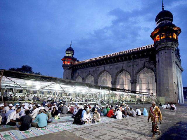 Muslims break their fast on the first day of Ramadan at Mecca Masjid in Hyderabad. Muslims throughout the world are marking the month of Ramadan, the holiest month in Islamic calendar. (AP Photo)