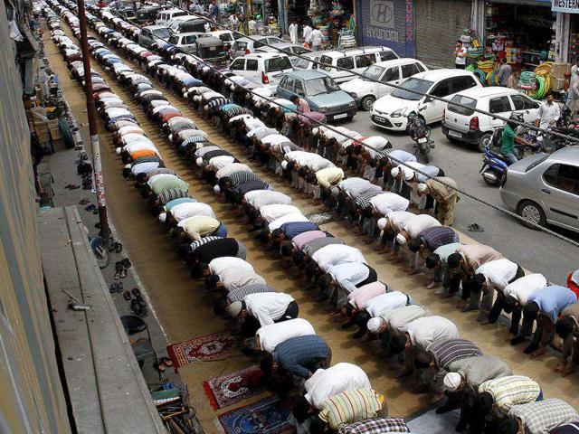 Kashmiri Muslims pray on a street on the first day of Ramadan, in Srinagar. Muslims throughout the world are marking the month of Ramadan, the holiest month in Islamic calendar where devout fast from dawn till dusk. (AP Photo)