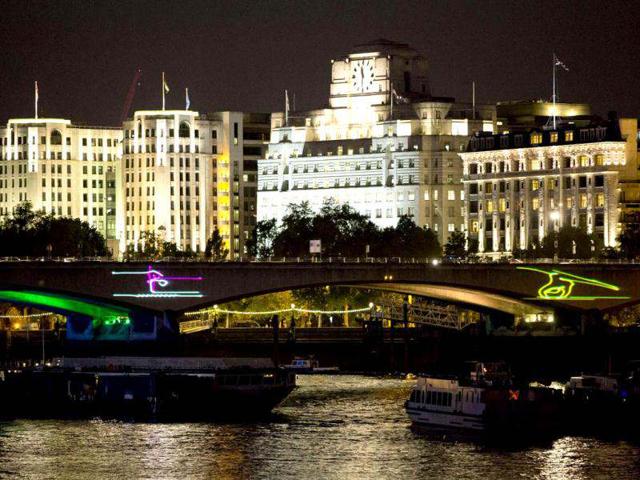 A view of Waterloo Bridge is seen as it is lit up with pictograms to celebrate the Olympics in London. (Reuters Photo/Neil Hall)