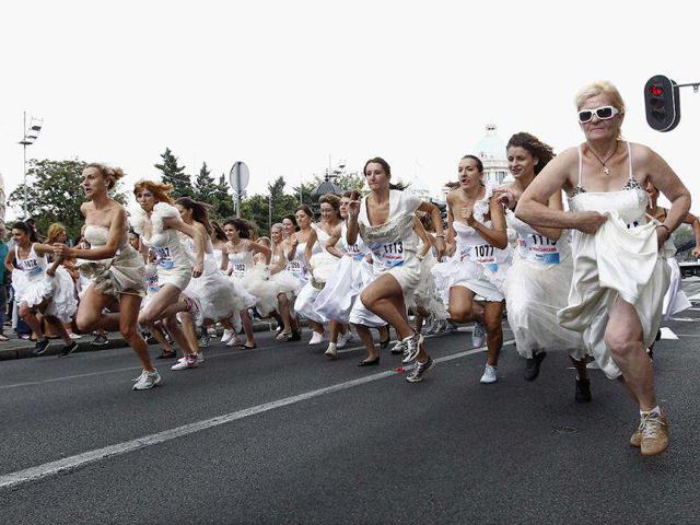 Women dressed in bridal gowns sprint during the annual Bridal race in central Belgrade. The winner and two runners-up receive numerous awards including the wedding gown they had chosen to race in. Reuters/Ivan Milutinovic
