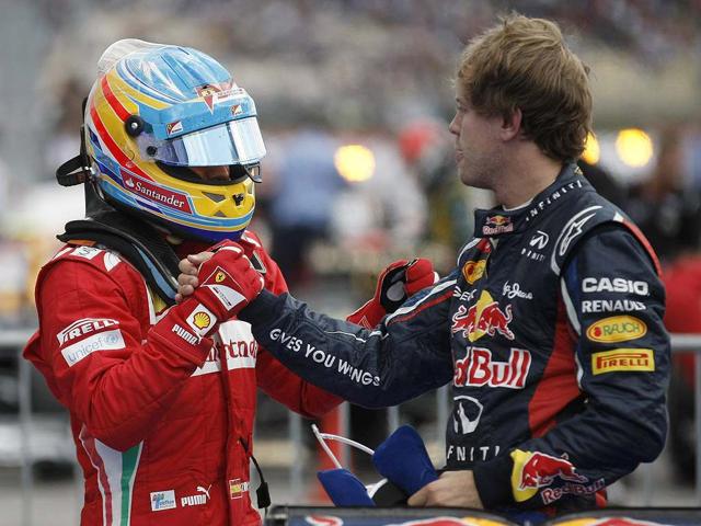 Ferrari Formula One driver Fernando Alonso (L) of Spain shakes hands with second placed Red Bull Formula One driver Sebastian Vettel of Germany after winning the German F1 Grand Prix at the Hockenheimring in Hockenheim. REUTERS/Alex Domanski Ferrari Formula One driver Fernando Alonso (L) of Spain shakes hands with second placed Red Bull Formula One driver Sebastian Vettel of Germany after winning the German F1 Grand Prix at the Hockenheimring in Hockenheim. REUTERS/Alex Domanski