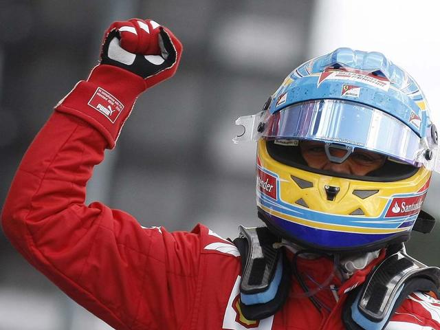 Ferrari Formula One driver Fernando Alonso of Spain celebrates after winning the German F1 Grand Prix at the Hockenheimring in Hockenheim. REUTERS/Alex Domanski Ferrari Formula One driver Fernando Alonso of Spain celebrates after winning the German F1 Grand Prix at the Hockenheimring in Hockenheim. REUTERS/Alex Domanski
