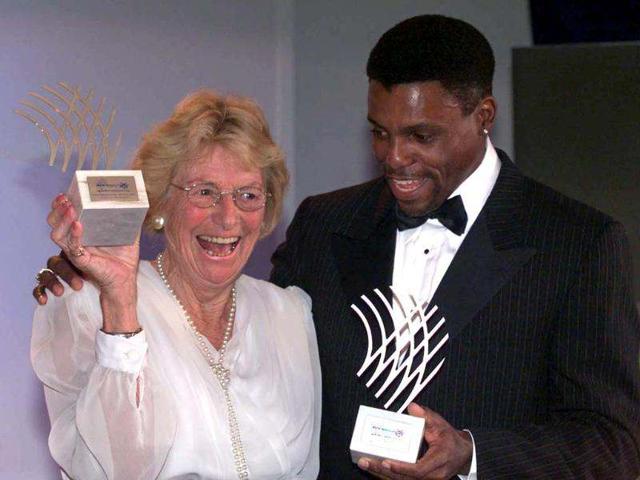 Dutch 1948 Olympic Champion Fanny Blankers-Koen (L) holds up her trophy as she poses with US champion Carl Lewis after they received their "Athlete of the Century" awards during the World Athletic Federation gala in Monte Carlo. In 1948, Fanny demolished prejudices about gender, age and motherhood and, as a pioneer and standard-bearer who inspired millions, established the legitimacy of women's sport in an Olympic movement. Reuters photo