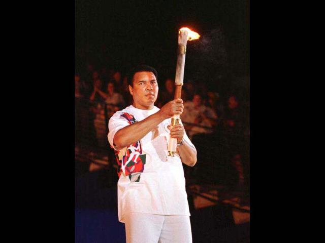 Former boxer Cassius Clay's impact on Rome 1960 is talked up because of the worldwide fame he later gained as Muhammad Ali. Here he holds up the torch during the opening ceremonies of the XXVI Centennial Olympic Games in Atlanta. Reuters/Andy Clark