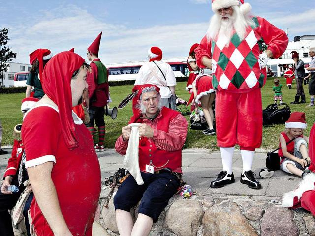 Santas from all parts of the world take part in the traditional foot bath at Bellevue Beach north of Copenhagen, Denmark. The bath marks the beginning of the annual World Santa Claus Congress.
