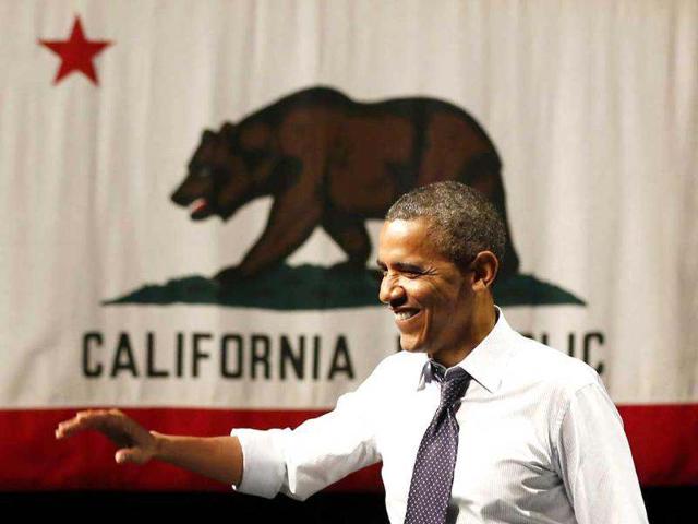 US President Barack Obama waves before he speaks at a campaign event at the Fox Theatre Oakland in Oakland. Reuters/Larry Downing