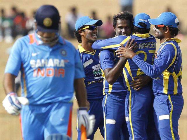 Sri Lanka's Angelo Mathews (3rd L) celebrates with his teammates after taking the wicket of India's captain Mahendra Singh Dhoni during their second one-day international cricket match, in Hambantota. Reuters Photo/Dinuka Liyanawatte