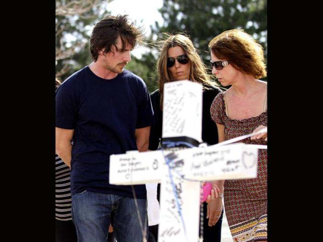 Actor Christian Bale and his wife Sandra Blazic at the memorial across the street from the Century 16 movie theater in Aurora, Colorado. The memorial was created for the victims of the mass shooting that occured at the theater last Friday.