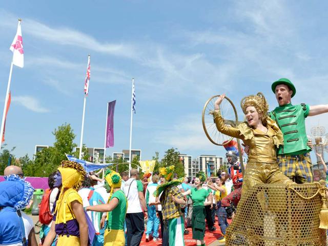 Artists perform during an arrival ceremony for athletes at the Olympic Village in London, two days before the start of the London 2012 Olympic Games. AFP/Adek Berry