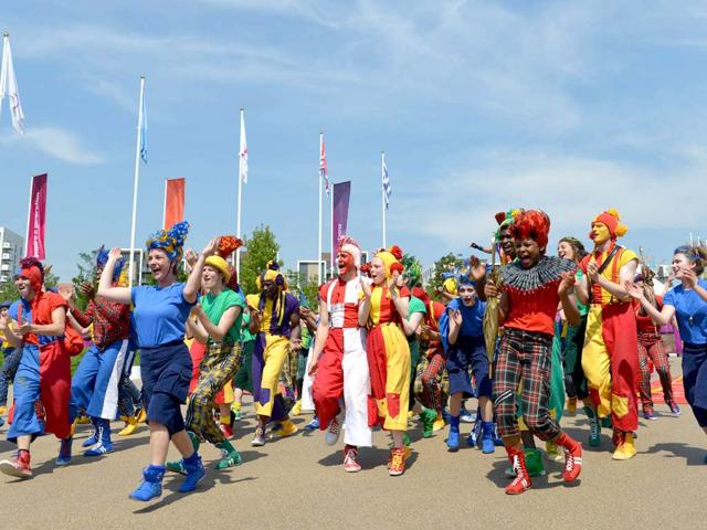 Dancers perform during an arrival ceremony for athletes at the Olympic Village in London, two days before the start of the London 2012 Olympic Games. AFP/Adek Berry