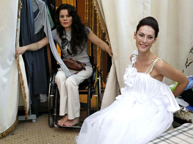 Models with physical disabilities prepare to take part in a 'Fashion week chance' show in Kiev. REUTERS/Gleb Garanich