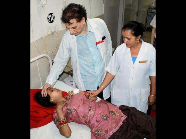 An injured Amarnath pilgrim is treated at the Government Medical College Hospital in Jammu after a truck skidded off the road and fell into a gorge near Pappad Morh in Samba district. PTI Photo