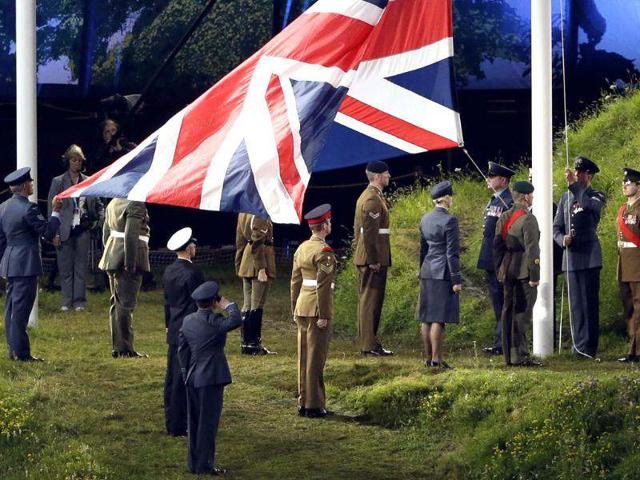 The British flag is raised up during the Opening Ceremony at the 2012 Summer Olympics in London. (AP Photo/Paul Sancya)