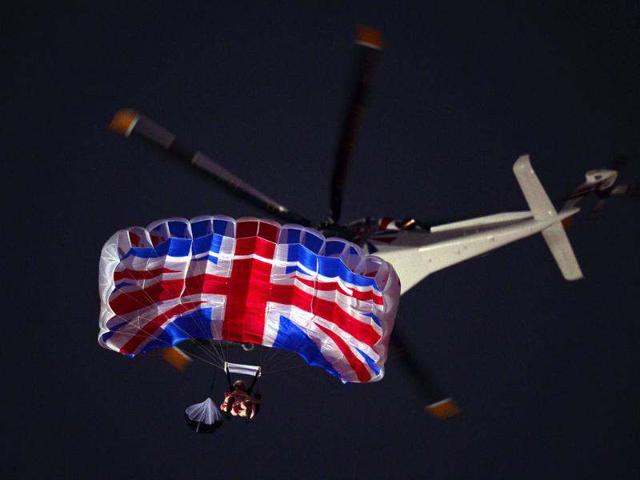 An actor dressed to resemble Britain's Queen Elizabeth II parachutes over the stadium during the opening ceremony of the London 2012 Olympic Games at the Olympic Stadium in London. (AFP photo/Olivier Morin)
