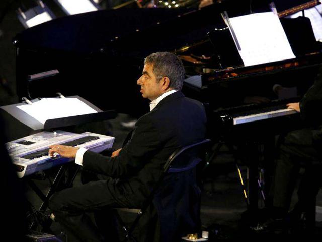 Actor Rowan Atkinson, known for his role as Mr Bean, performs during the opening ceremony of the London 2012 Olympic Games at the Olympic Stadium. (Reuters/Kai Pfaffenbach)