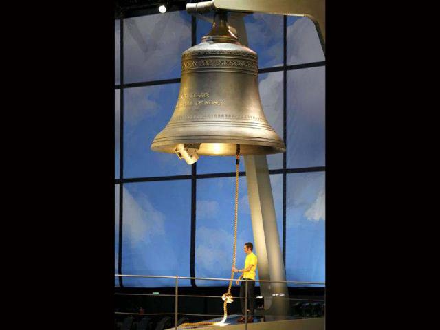 British cyclist and 2012 Tour De France winner Bradley Wiggins rings a giant bell during the opening ceremony of the London 2012 Olympic Games at the Olympic Stadium. (Reuters/Mike Blake)
