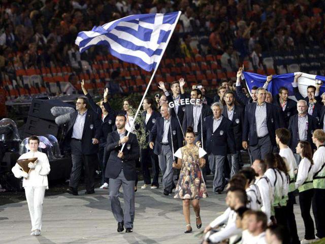 Greece's Alexandros Nikolaidis carries his national flag during the Opening Ceremony at the 2012 Summer Olympics in London. (AP Photo/Mark Humphrey)