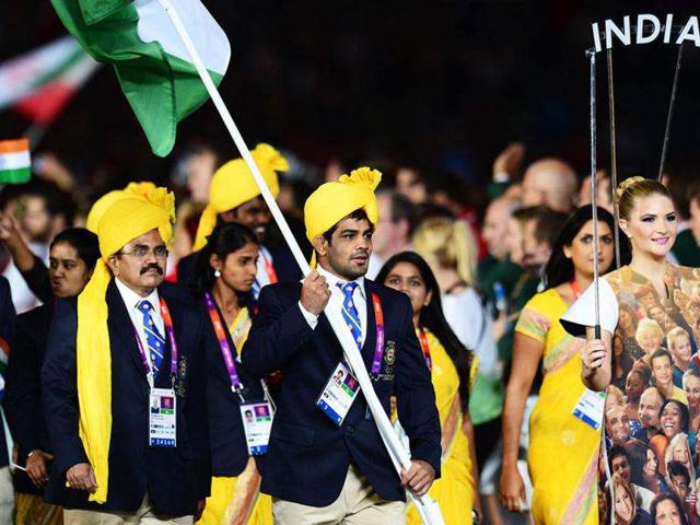 Flagbearer Sushil Kumar leads his delegation as they parade in the opening ceremony of the London 2012 Olympic Games in the Olympic Stadium in London. AFP/Olivier Morin