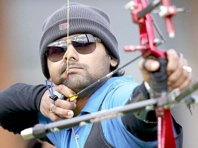 Rahul Banerjee takes aim during the men's archery team eliminations at the Lords Cricket Ground during the London 2012 Olympics Games July 28, 2012. Reuters/Suhaib Salem