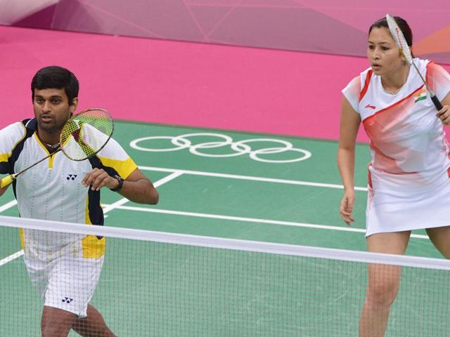 Diju V and Jwala Gutta return to Indonesia's Lilyana Natsir and Ahmad Tontowi during their mix double group play stage at the London 2012 Olympic Games in London. AFP/Adek Berry