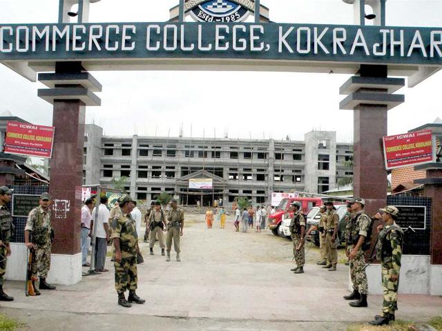 Army and BSF personnel stand guard outside a relief camp in Kokrajhar district on Saturday, ahead of Prime Minister Manmohan Singh's visit to the riot hit districts. PTI Photo