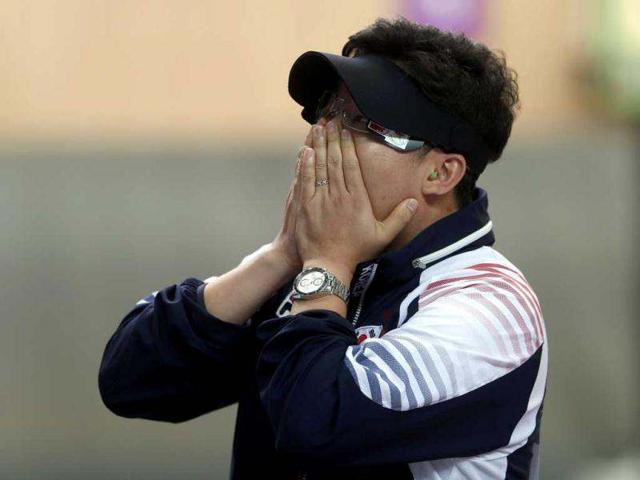 South-Korea-s-Jin-Jong-oh-covers-his-face-after-winning-the-men-s-10m-air-pistol-final-at-the-London-2012-Olympic-Games-in-the-Royal-Artillery-Barracks-at-Woolwich-in-London-Reuters-Eddie-Keogh South-Korea-s-Jin-Jong-oh-covers-his-face-after-winning-the-men-s-10m-air-pistol-final-at-the-London-2012-Olympic-Games-in-the-Royal-Artillery-Barracks-at-Woolwich-in-London-Reuters-Eddie-Keogh