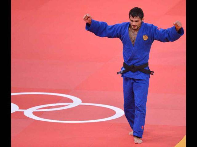Russia-s-Arsen-Galstyan-celebrates-after-winning-against-Uzbekistan-s-Rishod-Sobirov-during-their-men-s-60-kgs-contest-semi-final-match-of-the-judo-event-at-the-London-2012-Olympic-Games-AFP-Johannes-Eisele