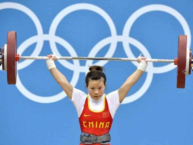 China-s-Wang-Mingjuan-lifts-during-the-women-s-48kg-group-A-weightlifting-competition-at-The-Excel-Centre-in-London-during-the-2012-Olympic-Games-AFP-Yuri-Cortez China-s-Wang-Mingjuan-lifts-during-the-women-s-48kg-group-A-weightlifting-competition-at-The-Excel-Centre-in-London-during-the-2012-Olympic-Games-AFP-Yuri-Cortez