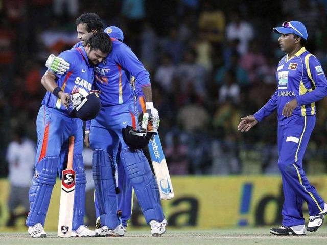 Sri Lanka's captain Mahela Jayawardene looks on as India's Irfan Pathan and Suresh Raina celebrate after winning the third One-Day International cricket match against Sri Lanka in Colombo. Reuters/Dinuka Liyanawatte