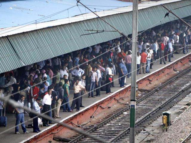 Stranded passengers wait for trains at the New Delhi railway station in New Delhi. A major power outage has struck northern India, plunging cities into darkness and stranding hundreds of thousands of commuters. AP Photo/Rajesh Kumar Singh