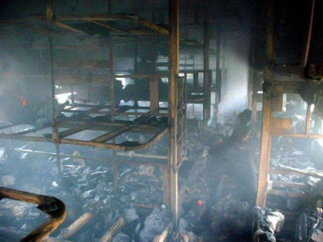 A charred coach from inside is seen of a passenger train at Nellore nearly 500 kilometers (310 miles) south of Hyderabad. AP Photo