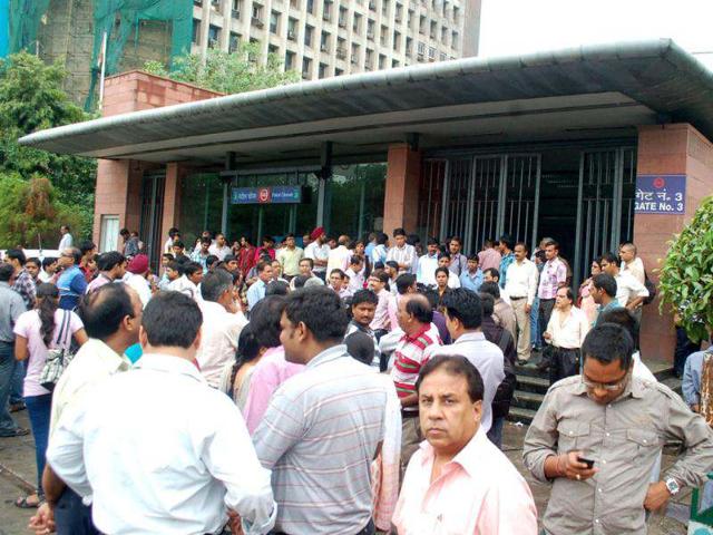 Passengers stranded outside Metro stations in New Delhi following power outage in New Delhi.