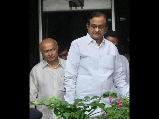 Union home minister P Chidambaram and power minister Sushil Kumar Shinde are seen after a meeting of Empowered Group of Ministers over relief measures to tackle the drought-like situation unfolding in several states. PTI/Subhav Shukla