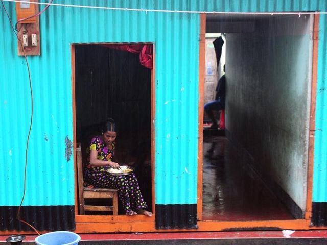 A Bangladeshi sex worker eats a meal at a brothel, in existence for at least a century, in Madaripur. AFP photo/Munir uz Zaman