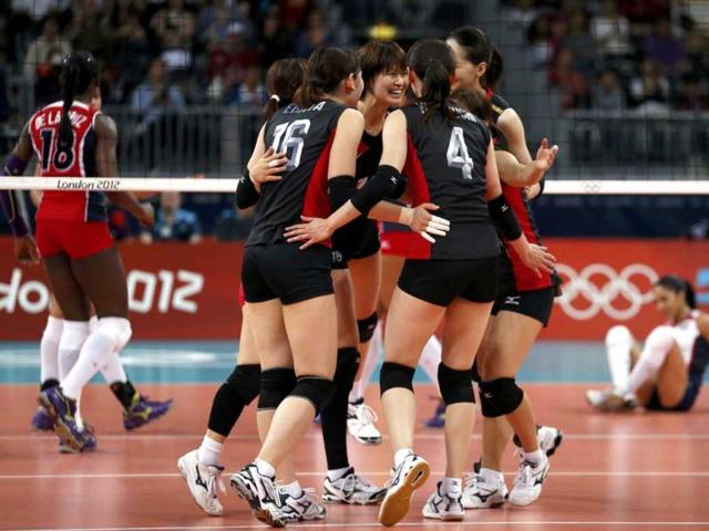 Japan's players celebrate a point against the Dominican Republic during their women's Group A volleyball match at Earls Court during the London 2012 Olympic Games. Reuters/Ivan Alvarado