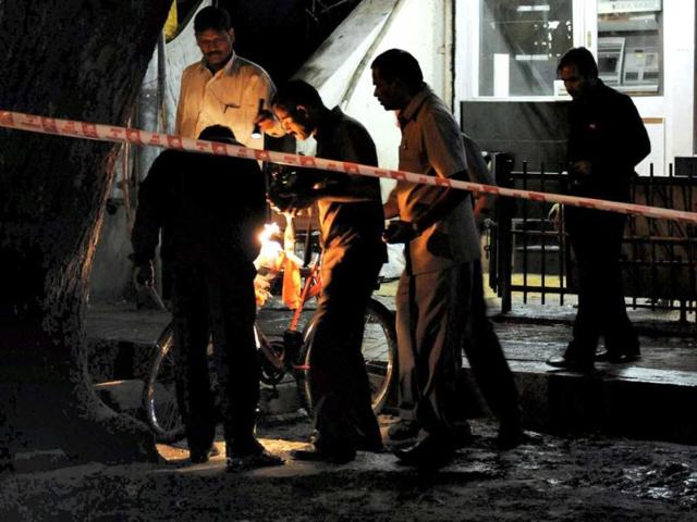 Police and bomb detection and disposal squad (BDDS) at a blast site in Pune. PTI Photo