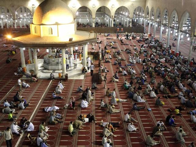 Men rest before performing evening prayers in the holy month of Ramadan at a mosque in Cairo. Reuters photo/Asmaa Waguih