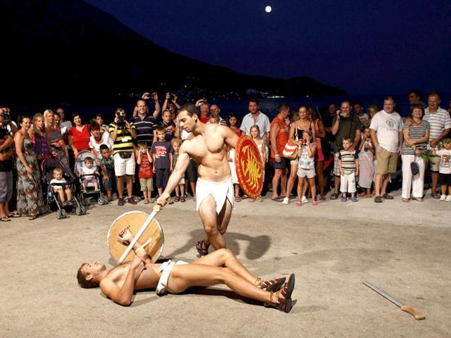 Performers re-enact a sword fight during the Night of King Arthur in Igrane. Historian John Matthews believes the gravestone found in Dalmatia near Podstrana, about 70 km (43 miles) from Igrane is really King Arthur's. Reuters photo/Antonio Bronic