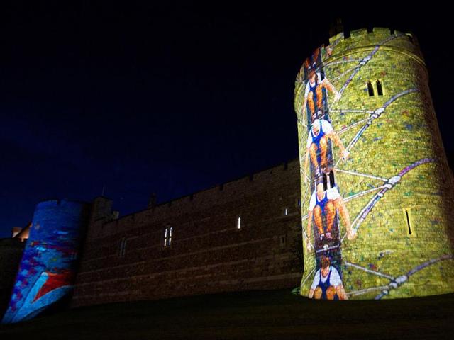 Windsor Castle is lit up with pictures of British Olympic rowers, past and present to coincide with the London 2012 Olympic Games rowing events held in the area, in Windsor. AFP Photo/Andrew Cowie