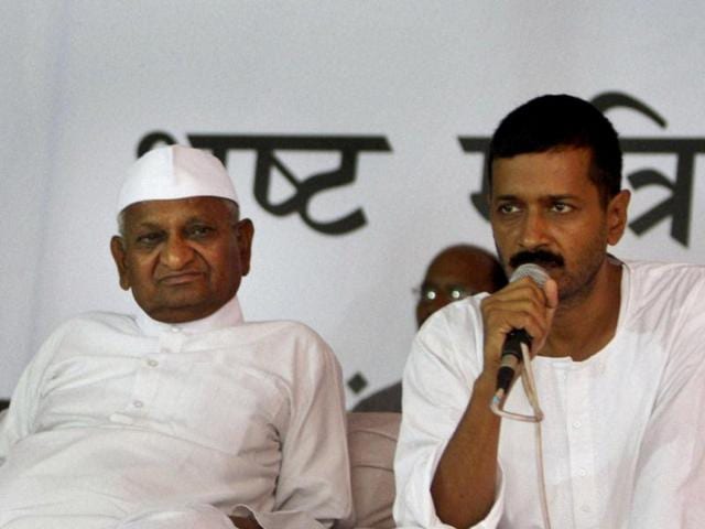 Anti-corruption activist Anna Hazare, left, sits with his key aide Arvind Kejriwal, during a protest at Jantar Mantar in New Delhi. AP Photo