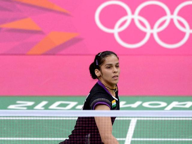 Saina Nehwal plays a shot against Denmark's Tine Baun during a quarterfinal women's singles badminton match at the London 2012 Olympics. (AFP Photo)