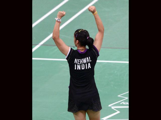 Saina Nehwal celebrates her victory over Tine Baun of Denmark after a quarterfinal women's singles badminton match at the London 2012 Olympics. (AFP Photo)