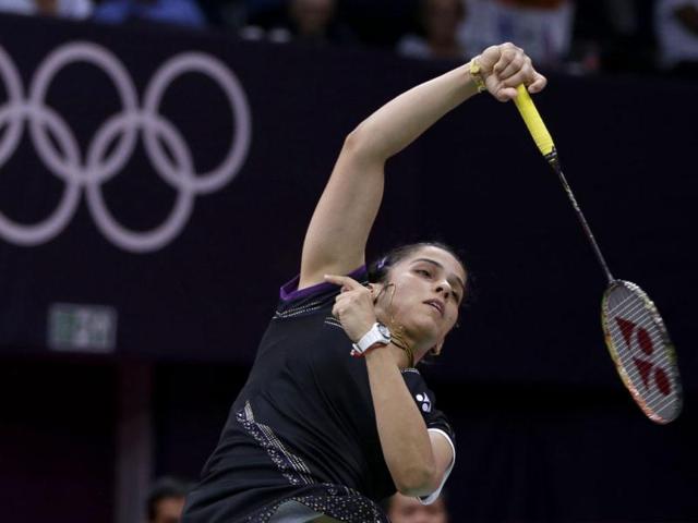 Saina Nehwal returns a shot to Tine Baun of Denmark at the 2012 Summer Olympics, in London. (AP Photo)